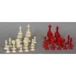 A 19th century carved bone and stained bone chess set The kings 14 cm high.