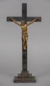 An 18th century carved crucifix The gilded Christ with a rope tied perosium. 43 cm high.