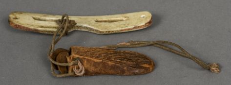A pair of bone glasses and a leather pouch The former 14 cm wide.