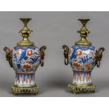 A pair of 18th century Chinese porcelain baluster vases Both with later European ormolu mounts and
