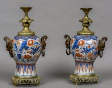 A pair of 18th century Chinese porcelain baluster vases Both with later European ormolu mounts and