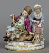 A 19th century Meissen porcelain figural group Formed as a woodsman and his wife. 13 cm wide.