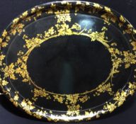A 19th century papier mache tray Gilt decorated with blossoming vines. 78.5 cm wide.