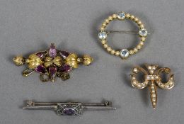 Three various Victorian/Edwardian gold brooches and a silver brooch Various sizes.