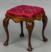 A 19th century Dutch marquetry stool The overstuffed drop-in seat above the shaped frieze,