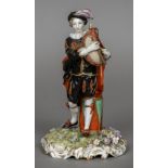 A Continental porcelain figure of a piper Modelled standing before a drum,