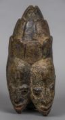 A rare tribal twin mask Formed as a pair of conjoined heads. 32 cm high.