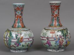 A pair of Chinese porcelain bottle vases Each decorated with children in a continuous garden