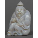 A Chinese carved opalescent stone snuff bottle Formed as a bearded figure. 5.5 cm high.