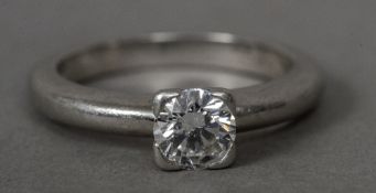 A diamond set platinum solitaire ring The stone approximately 0.45 carats.