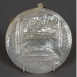 A carved mother-of-pearl shell One side decorated with the Last Supper. 14 cm wide.