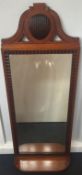 A 19th century Continental mahogany pier glass The bevelled rectangular plate within a ripple