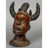 An African tribal mask The multi-horned bust covered with animal hide. 27.5 cm high.