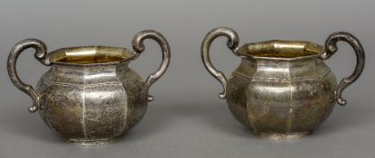 A pair of Victorian silver twin handled sugar bowls, each hallmarked London 1899,