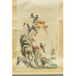 A Chinese painted scroll Worked with birds perched on flowering boughs issuing from a pierced rock,