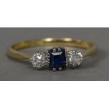 A diamond and sapphire set 18 ct gold and platinum three stone ring CONDITION REPORTS: