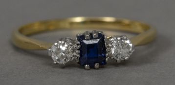 A diamond and sapphire set 18 ct gold and platinum three stone ring CONDITION REPORTS: