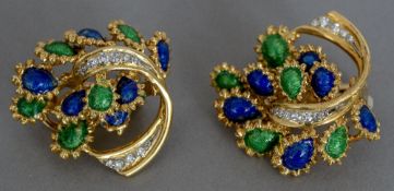 A pair of Kutchinsky 18 ct gold ear clips Each set with a band of diamonds and with blue and green