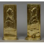 A pair of Arts & Crafts brass wall sconces Each repousse decorated with a bust of a cloaked young