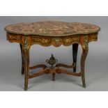 A 19th century marquetry inlaid centre table The shaped top with profusely inlaid marquetry