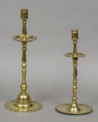 A 17th century Dutch brass candlestick Together with another, 18th century.