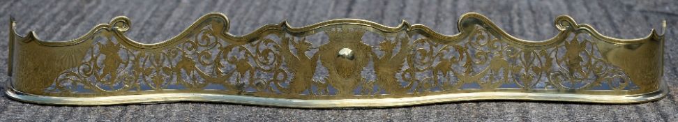 A 19th century pierced brass fender Of serpentine form,