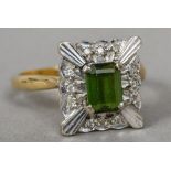 An 18 ct gold diamond and peridot ring CONDITION REPORTS: Generally in good