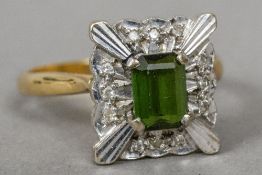 An 18 ct gold diamond and peridot ring CONDITION REPORTS: Generally in good