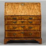 An 18th century walnut bureau The line inlaid fall enclosing a fitted interior with a baize lined