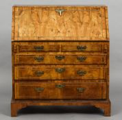 An 18th century walnut bureau The line inlaid fall enclosing a fitted interior with a baize lined