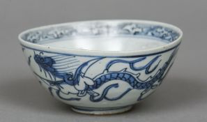 A Chinese blue and white porcelain bowl Decorated with dragons chasing flaming pearls.
