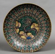 A 19th century Japanese charger Decorated in the famille verte palette centred with a dragon.