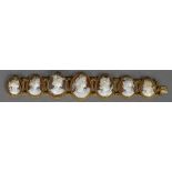 A 19th century unmarked gold cameo bracelet Set with seven classically carved portrait busts.