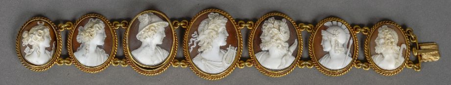 A 19th century unmarked gold cameo bracelet Set with seven classically carved portrait busts.