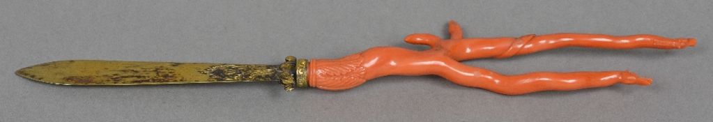 A 19th century coral mounted unmarked gilt metal paper knife The engraved handle with an acanthus