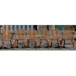 A set of six George III style wheel back chairs,