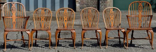 A set of six George III style wheel back chairs,