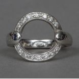 An 18 ct white gold diamond set ring designed by Asanti Of circular form the shank inscribed twice