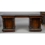 An early 19th century mahogany pedestal sideboard The inverted breakfront top above the twin