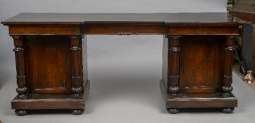 An early 19th century mahogany pedestal sideboard The inverted breakfront top above the twin