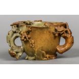 A 19th century Chinese carved soapstone libation cup Of organic form,