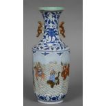 A Chinese porcelain vase The flared neck above twin pierced handles,