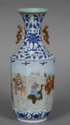 A Chinese porcelain vase The flared neck above twin pierced handles,