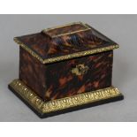 A 19th century French gilt bronze mounted tortoiseshell tea caddy Of sarcophagus form,