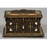 A late 19th century North African mother-of-pearl and bone inlaid carved hardwood casket The hinged