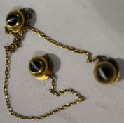 Three dress studs with trace chain