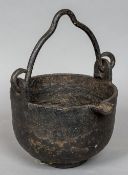 A 19th century cast iron smelting pot CONDITION REPORTS: Some old rust wear,