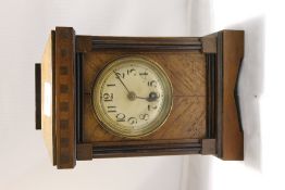 An early 20th century walnut cased mantle clock