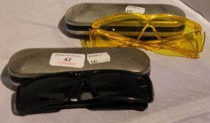 Two pairs of fishing glasses in cases