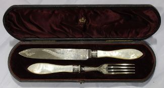 A cased silver and mother of pearl cake knife and fork